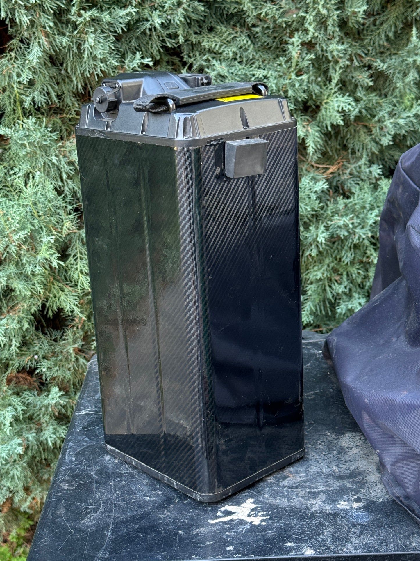Carbon fiber battery wrap, back corner