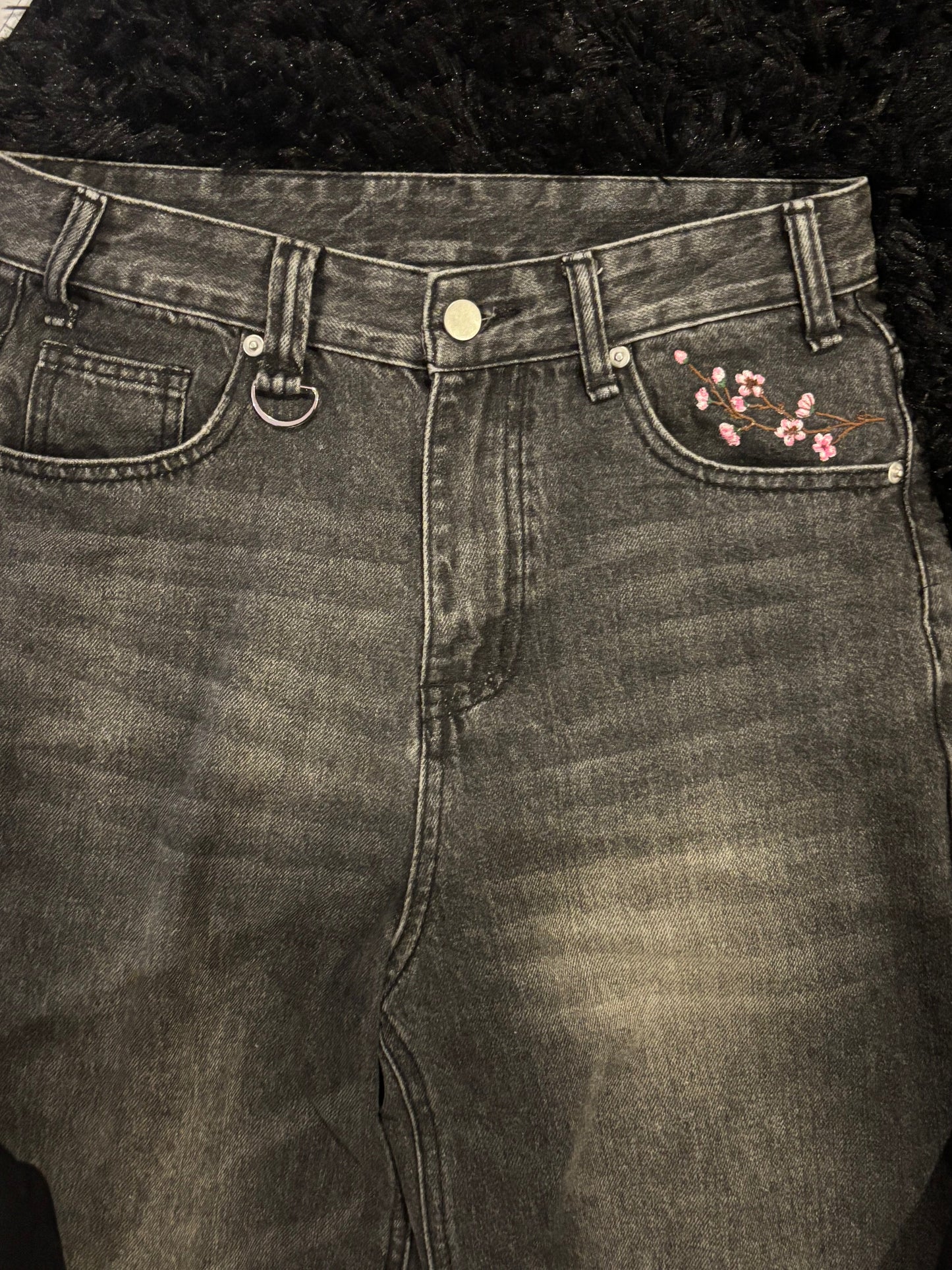 Baggy black embroidered jeans.