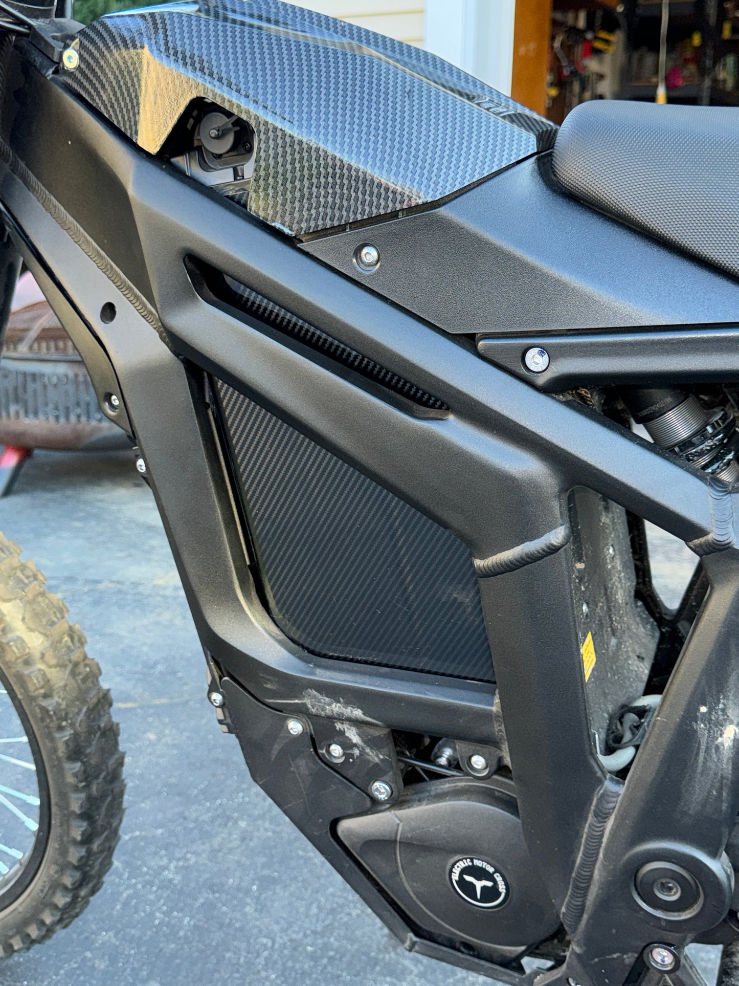 Carbon fiber battery wrap, in bike in in sunlight