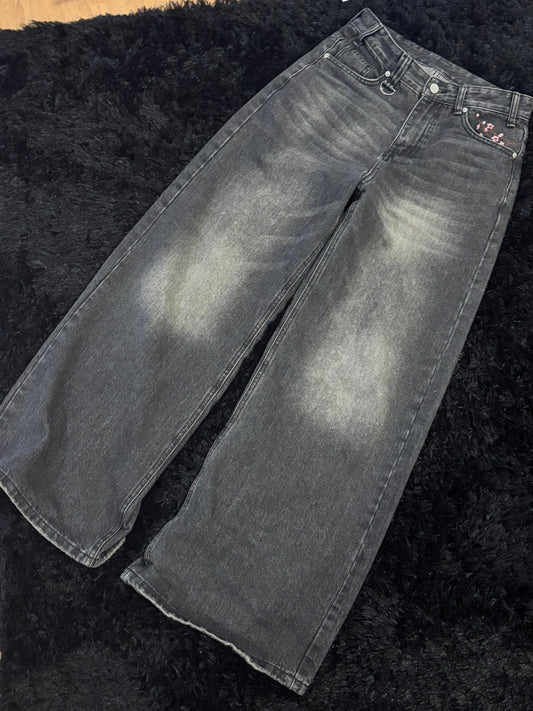 Baggy black embroidered jeans.