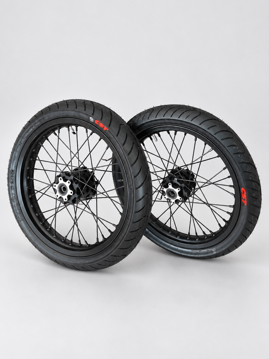 Talaria MX5 black Supermoto wheel set on a light gray studio background